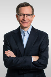 Phoenix Symphony President & CEO Peter Kjome, white male wearing glasses and a sport coat, arms folded